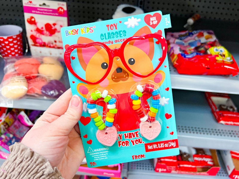 hand holding toy glasses with candy at walmart