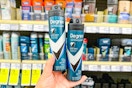 person holding 2 degree dry spray deodorants