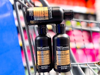 Three Tresemme Travel Size Shampoos in a Walmart shopping cart