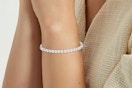 Close up shot of the APSVO 18K White Gold Plated Tennis Bracelet on women's wrist