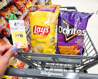 one bag of Lays and one bag of Doritos inside shopping cart