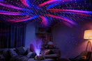 a star projector projecting on a ceiling