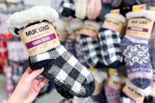 hand holding muk luks cabin socks set at walmart