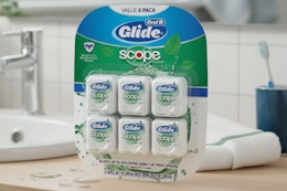 oral b scope floss pack on bathroom counter