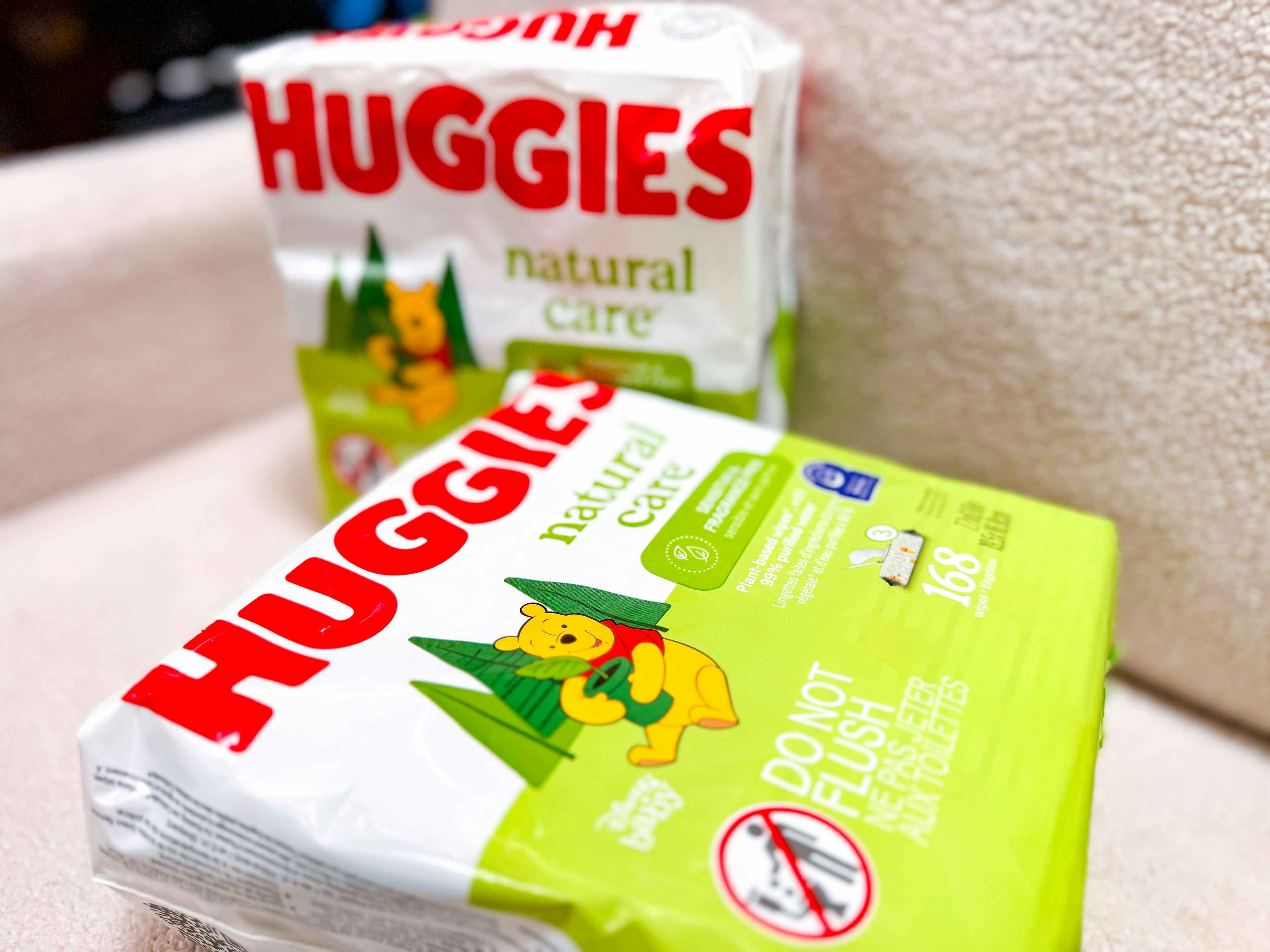 two packs of huggies natural care baby wipes on chair at walmart