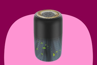 A black air purifier that cleans the air in rooms up to 600 square feet. Cylinder shaped with control buttons and gold vent on top.