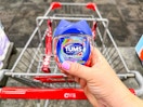 hand holding tums chewy bites over cvs cart