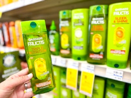 hand holding garnier fructis shampoo