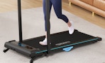 a person on a walking pad in room