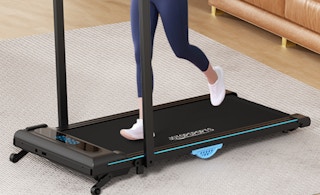 a person on a walking pad in room