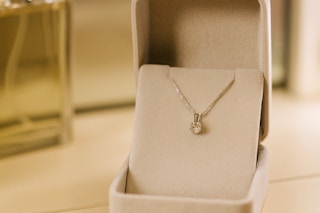 a diamond necklace in a jewelry box