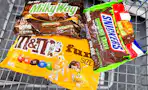 m&m's, milky way, and snickers candy bags in a cart