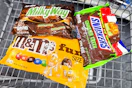 m&m's, milky way, and snickers candy bags in a cart