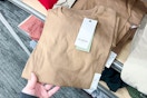 hand grabbing a goodfellow & co men's tee off a target shelf