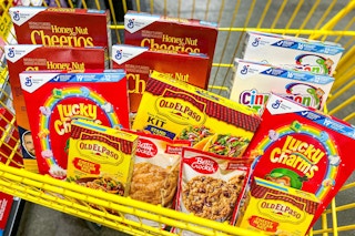 8 boxes of cereal, 2 cookie mixes, 2 rices, and 1 taco kit in a cart