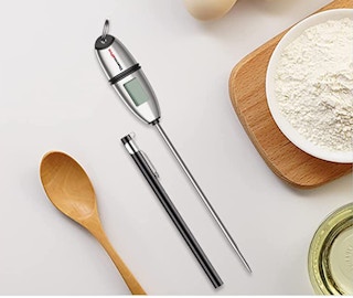 silver meat thermometer on a table