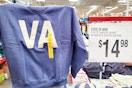 person holding up a state of mine sweatshirt