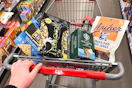 person pushing a cart with archer jerky, wonderful pistachios, kind bars, and more snacks