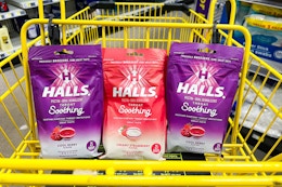 3 halls cough drops in a yellow dollar general shopping cart