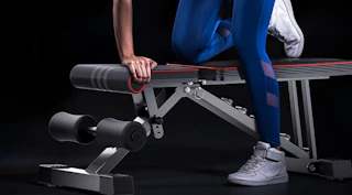 a person exercising on a workout bench