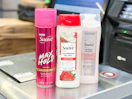 3 suave hair care products sitting in front of checkout