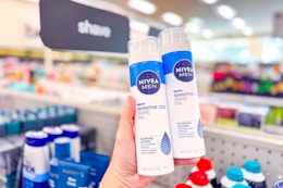person holding up 2 nivea men shave gels 