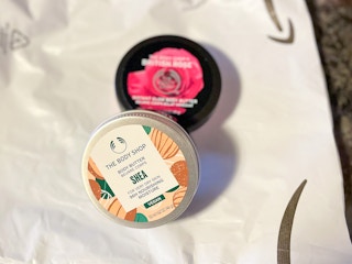 A set of Body Shop lotion on an Amazon package.