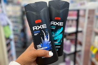 hand holding two Axe body washes