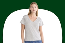 Woman wearing a gray v neck Free Assembly tee