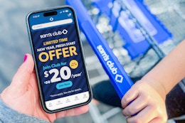 hand holding a phone with sams club membership offer