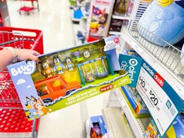 hand holding a bluey turtleboy bundle playset in front of target signage
