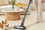 a woman vacuuming her living room