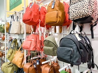handbags backpacks on a shelf at target
