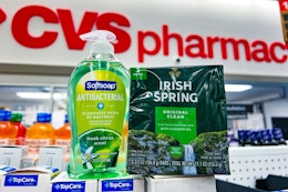 softsoap hand soap next to a 3-pack of irish spring bar soap with a cvs pharmacy sign in the background