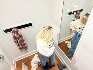 a woman in a dressing room 