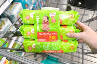 hand holding a pack on comforts baby wipes