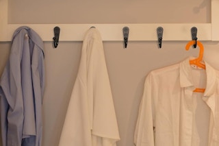 wall hooks holding clothes