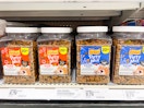 purina friskies 20-ounce party mix cat treats sitting on a target shelf