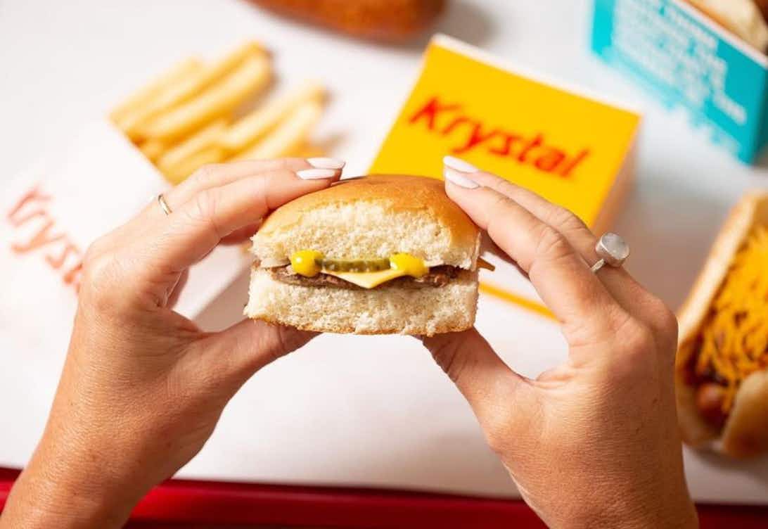 Someone holding a burger from Krystal
