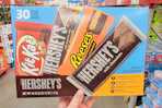 hand holding a box of hersheys bars
