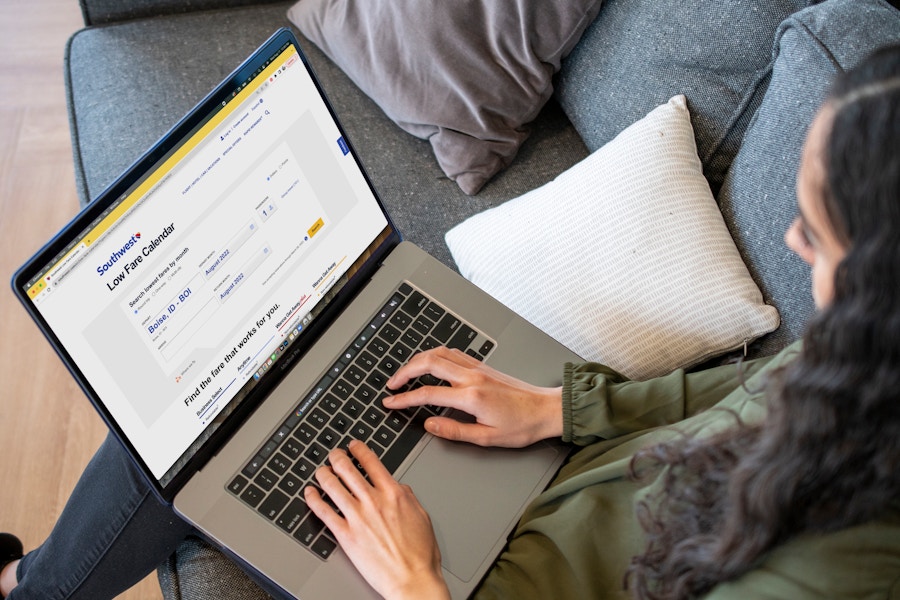 A woman looking at Southwest airlines website on a laptop computer