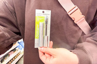 person holding a neutrogena mascara