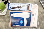 hair dryer, curling iron, and flat iron in a cart