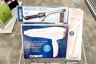 hair dryer, curling iron, and flat iron in a cart