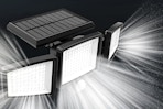 Lifestyle image of a solar light with beams of light shining (black background)