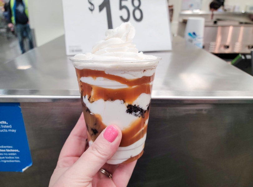 person holding a sundae