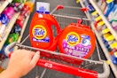 person pushing a cart with tide pods and liquid detergent in it