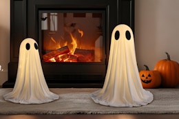 two ghosts in front of fireplace