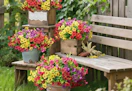 colorful flower bunches in buckets and small crate on wooden steps outside