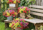colorful flower bunches in buckets and small crate on wooden steps outside
